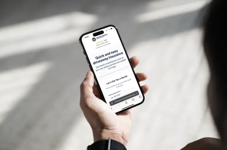 Phone screen displaying the Justdriveaway website