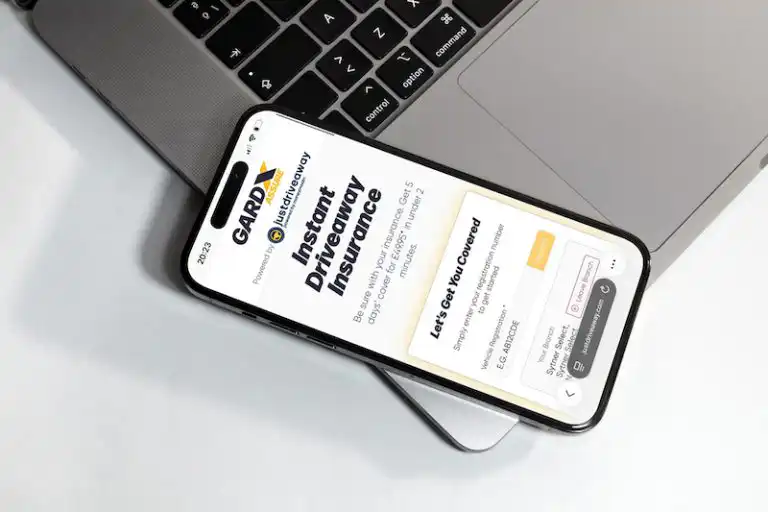 iPhone displaying the GardX instant driveaway insurance by Justdriveaway from Moneymaxim